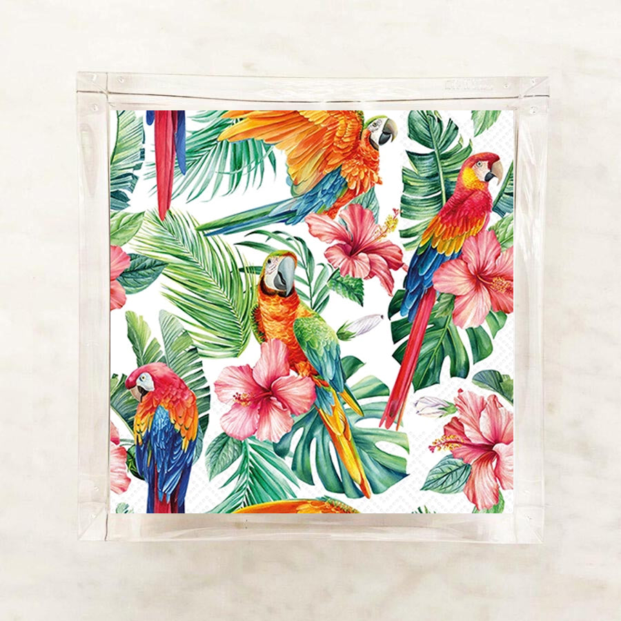 Tropical paper napkin with parrots, flowers, and leaves on a white background