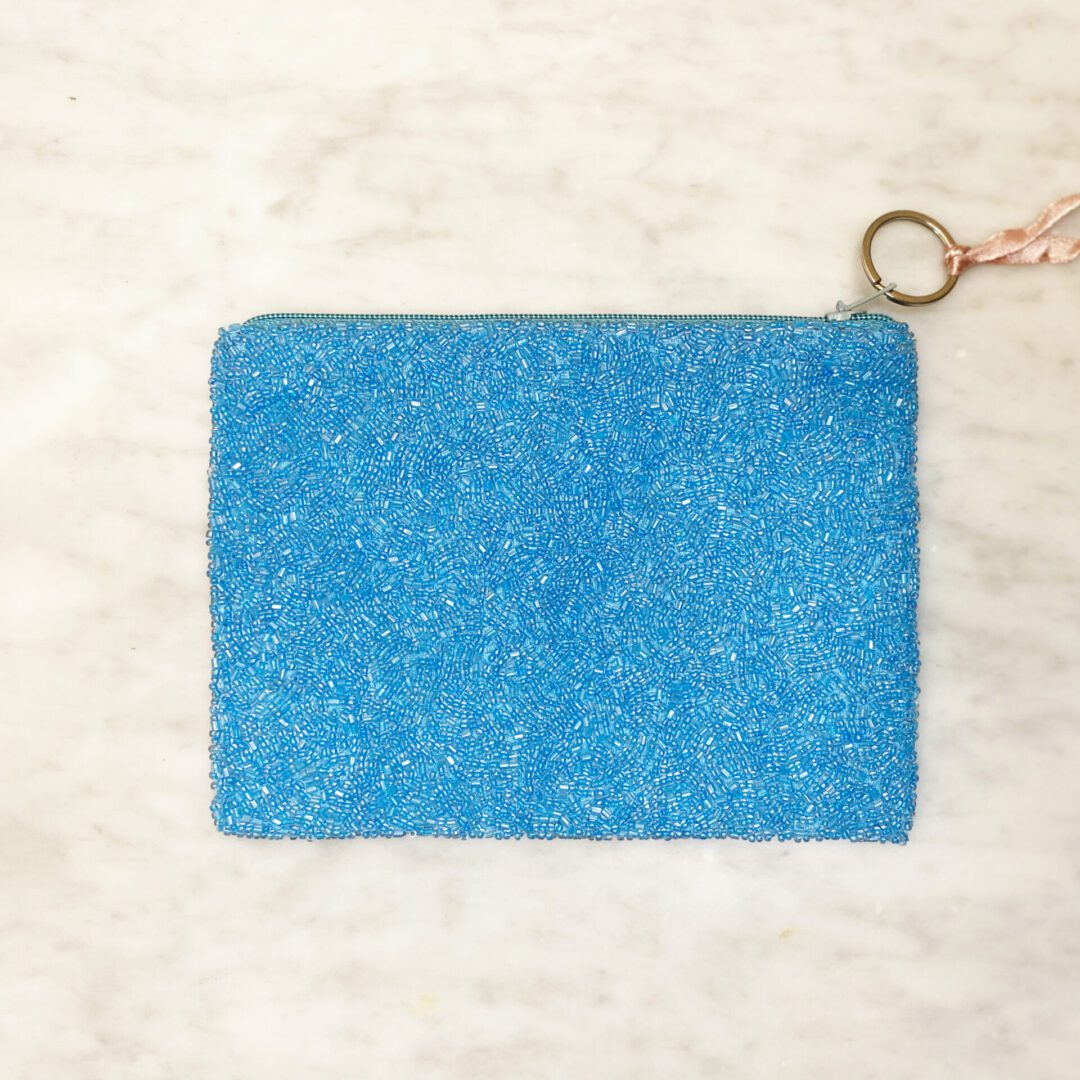 Puerto Rico beaded coin purse back view, fully beaded blue exterior with keyring wristlet strap