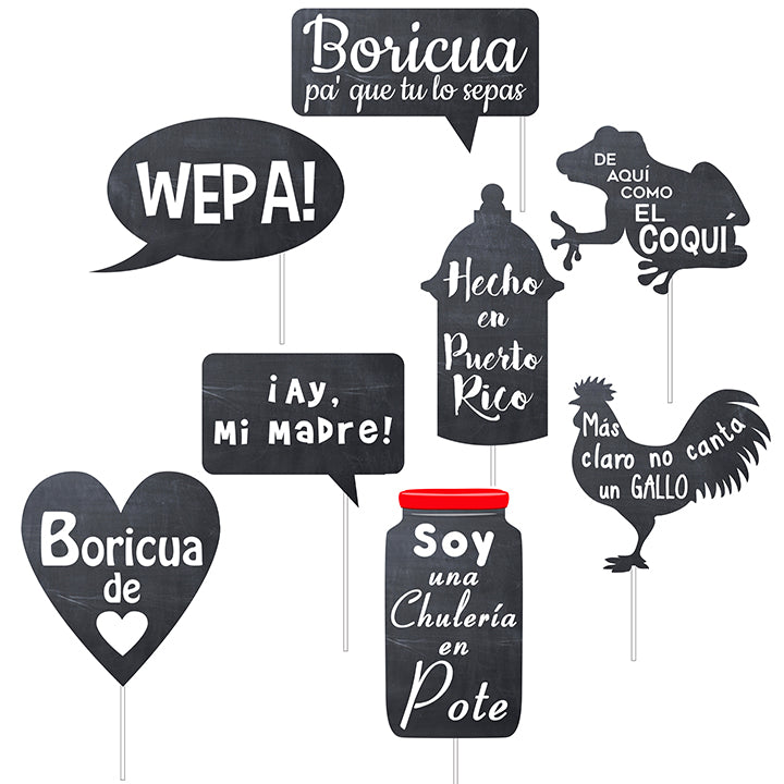 “Set of Puerto Rican-themed photo booth props with popular phrases in Spanish, including ‘Boricua pa’ que tú lo sepas,’ ‘Wepa!,’ ‘¡Ay, Mi Madre!,’ ‘De aquí como el coquí,’ ‘Hecho en Puerto Rico,’ ‘Más claro no canta un gallo,’ ‘Boricua de corazón,’ and ‘Soy una chulería en pote.’ Props are shaped like speech bubbles, a heart, a coquí frog, a rooster, garita and a jar, all designed in chalkboard style.”