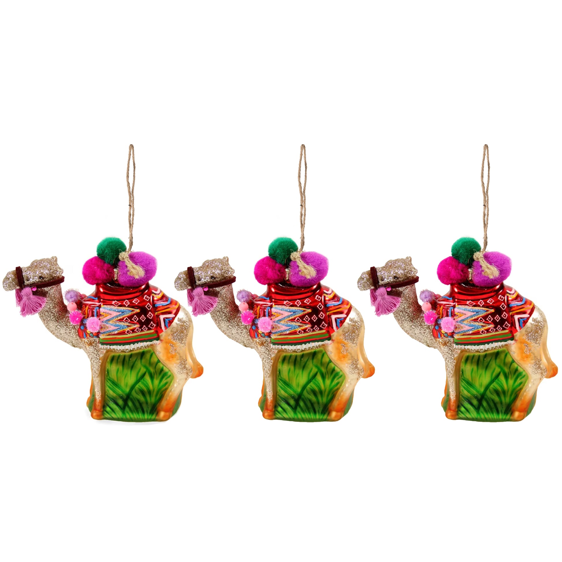 Three camel-shaped ornaments with colorful clothing and pink pom-poms on a white background