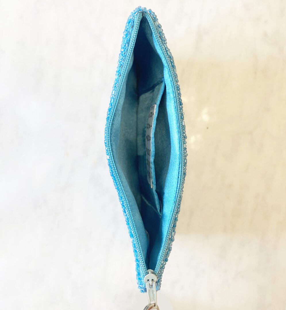 Puerto Rico beaded coin purse interior view, blue lining with zippered closure detail